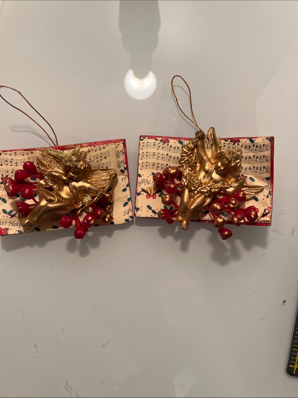 Two Gold Cherub Holiday Ornaments with Red Berry Accents